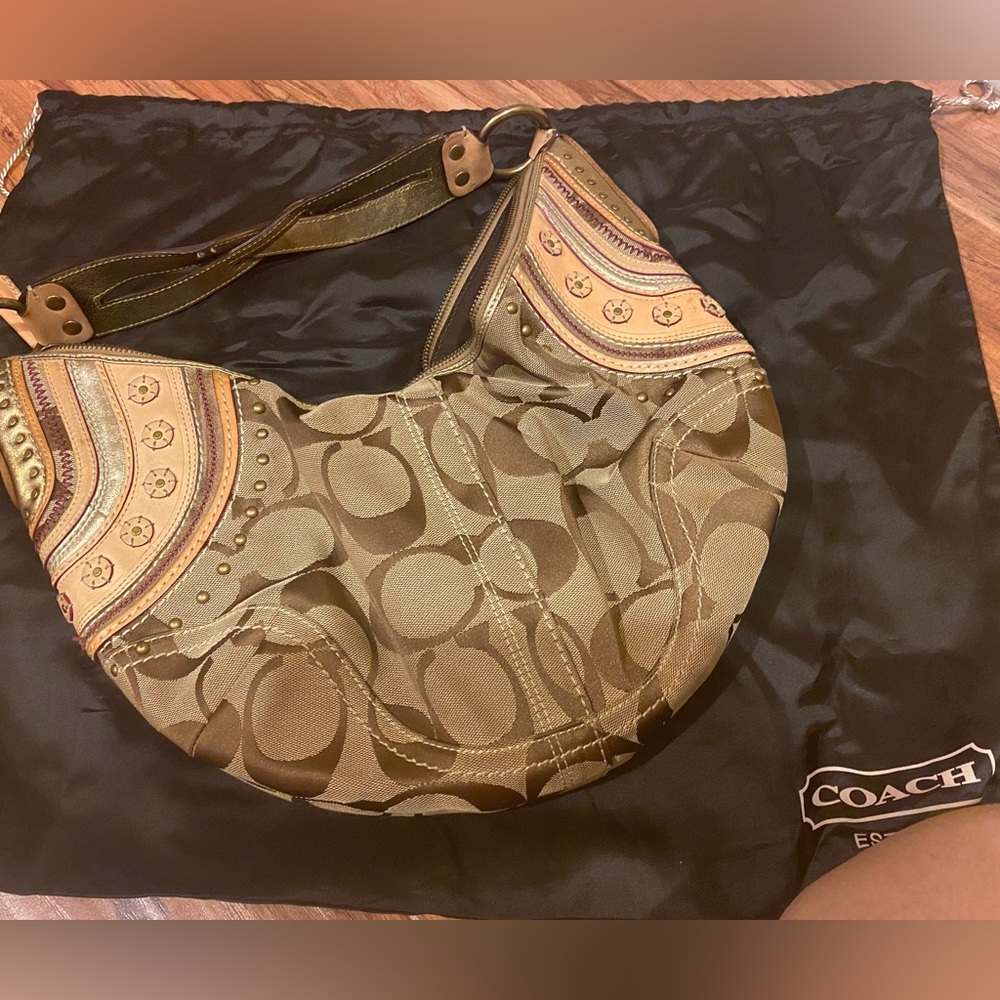 Coach handbag. Hobo style. Used, in good condition. Shows signs of normal wear.